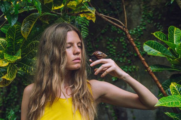 young woman with big snail
