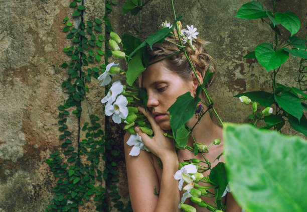 istock young woman merges with nature 1910313229