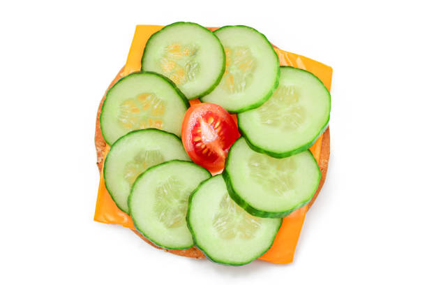 istock Cracker Sandwich with Fresh Cucumber, Tomato Cherry and Cheese - Isolated 1910331760