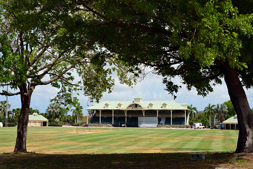 Osbourn, Saint George Parish, Antigua, Antigua and Barbuda: Coolidge Cricket Ground (aka Stanford Cricket Ground / Airport Cricket Ground) - open park, seen from the street - one of the home grounds of the Leeward Islands cricket team and also hosted many Twenty20 matches. This ground has hosted many matches of 2022 ICC Under-19 Cricket World Cup.