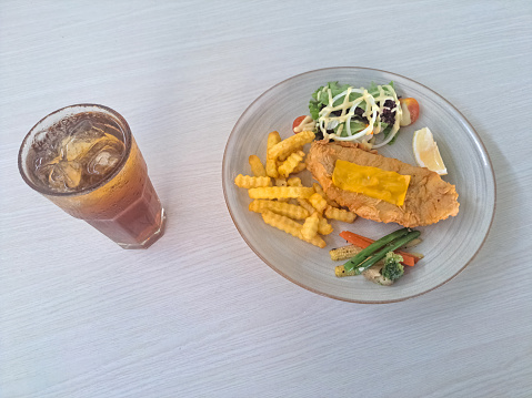Fish And Chips - Deep Fried Red Snapper Fillet In Crispy Batter, Served With Tar Tar Sauce. French Fries Or And Mixed Salad. Fresh Tea Iced. Food And Drink Menu.