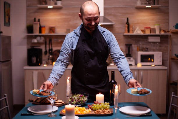 istock Holding plates with food 1910450272