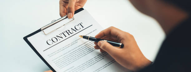 istock Business executive signing contract agreement document. Shrewd 1910461428