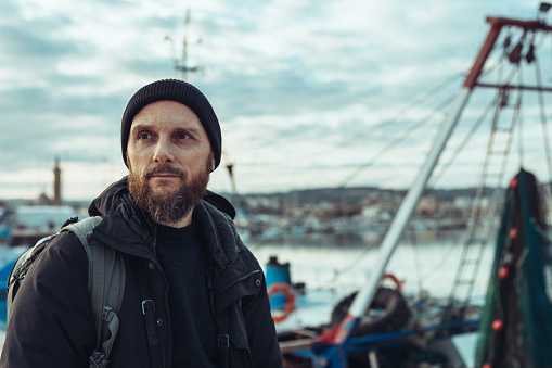 Photographer portrait at harbor: documenting fishing industry in Italy