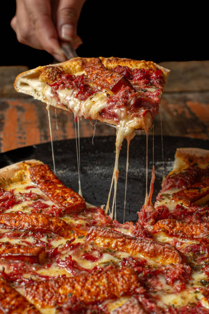 istock slice of dried meat and cheese pizza 1910498552