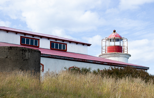 San Isidro lighthouse on a hill next to the coast, abandoned lighthouse