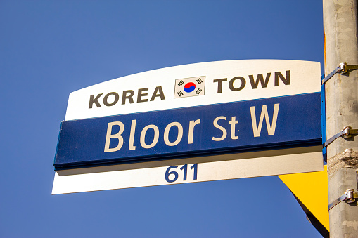 Toronto, Ontario, Canada. Jan 4, 2024. A street sign on a pole in Korea Town in Toronto.
