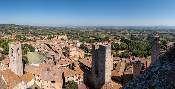 Wide panoramic view over downtown San Gimignano, Torri dei Salvucci in the center, seen from Torre Grosso, Italy