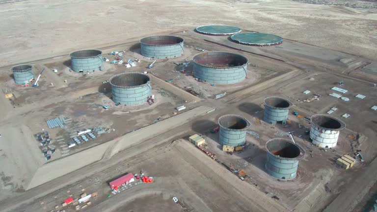 A Drone Point of View of a Large Oil Storage Site Under Construction in Eastern Utah on a Sunny Afternoon Winter Day