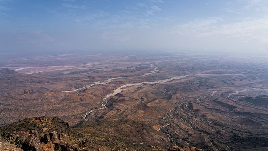 view of Jabal Samhan with majestic mountain range that offers a breathtaking escape into the heart of Oman's wilderness.