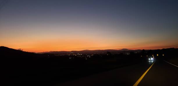 istock Sunset in the road 1910662227