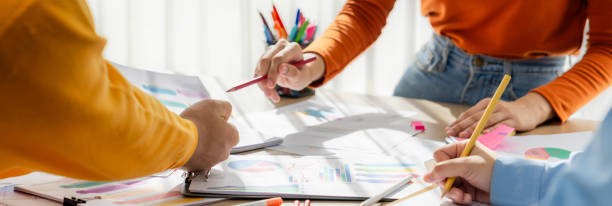 istock Startup company employee working together analyzing BI dashboard paper. Synergic 1910675029