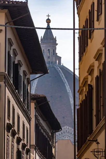 Photo of Cupola of the cathedral Santa Maria del Fiore in Florence, seen from a street far away