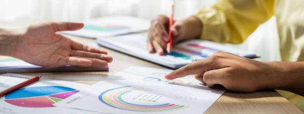 istock Startup company employee working together analyzing BI dashboard paper. Synergic 1910702714