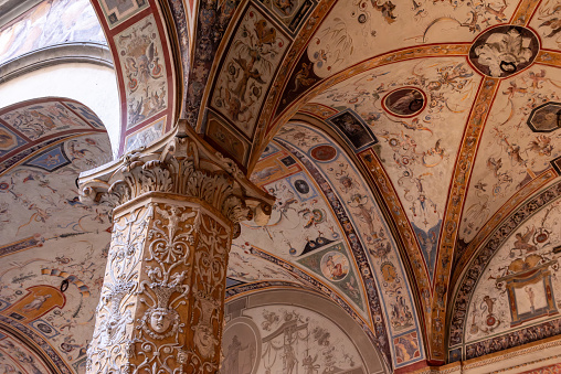 Wall frescoes of rich decorated courtyard of Palazzo Vecchio in Florence, Italy