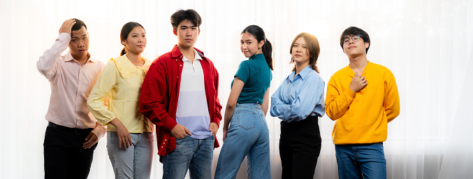 Panoramic banner young happy asian startup company employee wearing colorful casual wear stand in line together symbolize creative teamwork, job employment, HR agency recruitment. Synergic