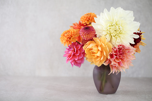 A pretty bouquet of different flowers isolated on a white background.