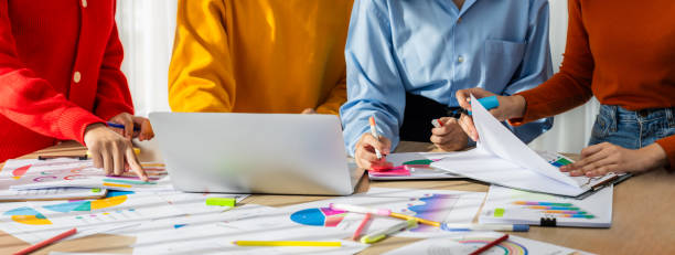 istock Startup company employee working together analyzing BI dashboard paper. Synergic 1910735525