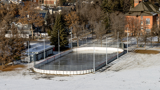 First ice on a city community ice ring in early winter season