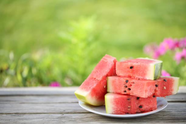 Free Stock Photo of A slice of watermelon on a wood surface | Download ...