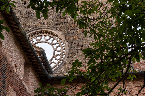 Destroyed window rosette at the abandoned Cistercian monastery San Galgano in the Tuscany, Italy