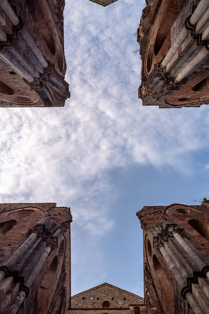 Missing ceiling opening the view to the sky in the destroyed abandoned Cistercian monastery San Galgano in the Tuscany, Italy