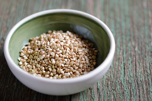 Wholegrain buckwheat in a green bowl