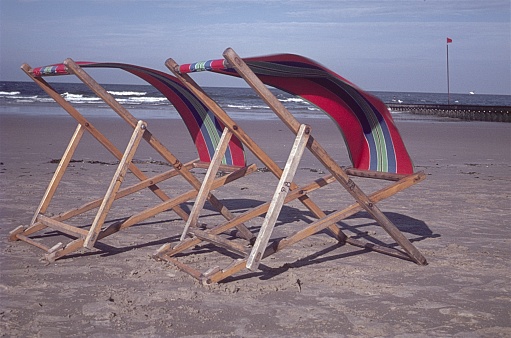 Borkum, Frisian Islands, Germany, 1965. Wooden deck chairs on a beach on the holiday island of Borkum.