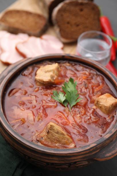 istock Tasty borscht in bowl on table, closeup 1910925135