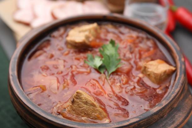 istock Tasty borscht in bowl on table, closeup 1910925150