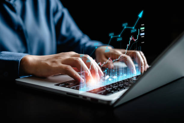 istock Businesswomen using laptops with virtual screens of graph stock market changes, uptrends, growth economics, business strategy development, and finding investment opportunities. 1910937190