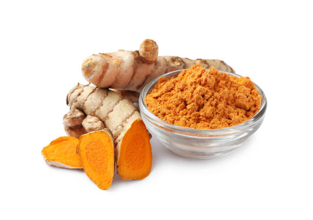 istock Bowl with aromatic turmeric powder and cut roots isolated on white 1910940676