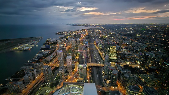 Overlooking the city of Toronto. Dark clouds over the city covering the sunset.