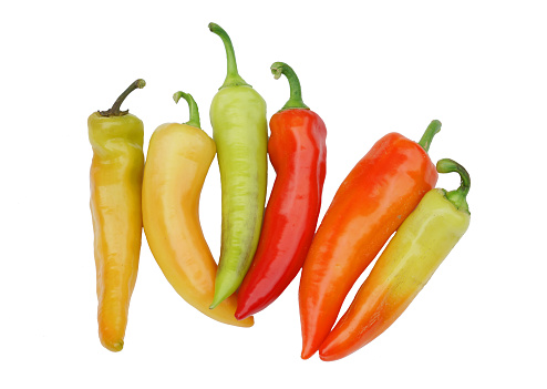 close up on fresh colorful peppers isolated on white background