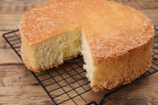 istock Tasty sponge cake on wooden table, closeup 1910965321