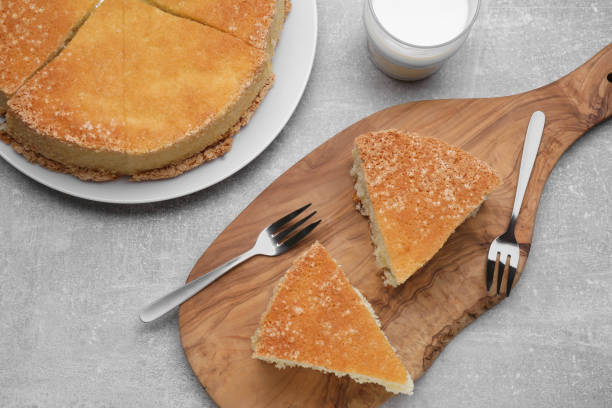 istock Tasty cut sponge cake on grey table, flat lay 1910969969