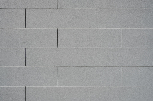 Close-up on part of a clean blank painted concrete wall.