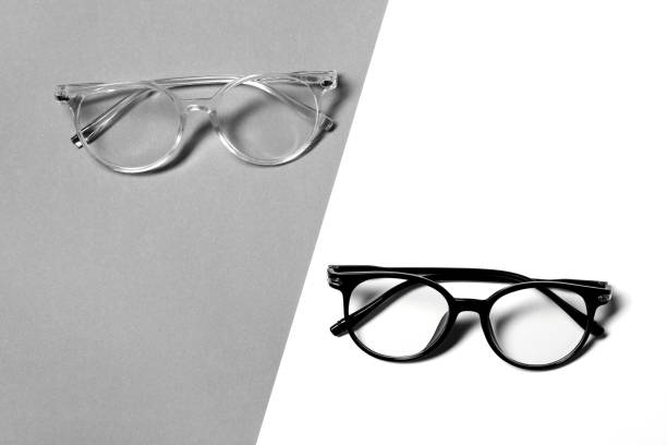 Stylish glasses on color background, flat lay