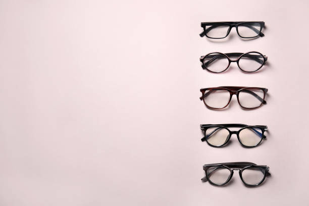 istock Many different stylish glasses on light grey background, flat lay. Space for text 1911034214