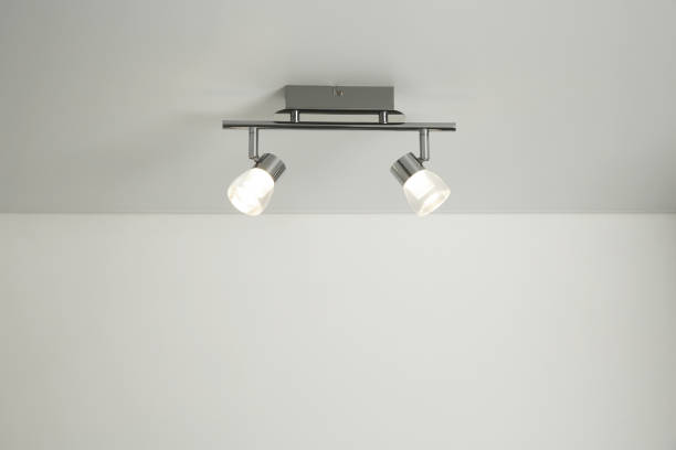 istock Stylish light fixture on ceiling indoors, low angle view 1911044183