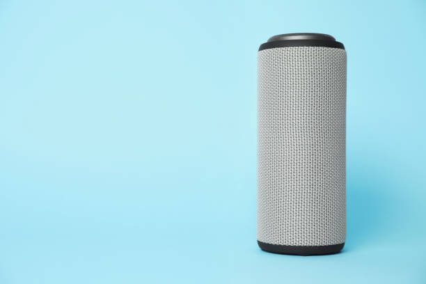 istock One portable bluetooth speaker on light blue background, space for text. Audio equipment 1911045256