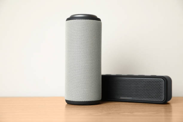 istock Portable bluetooth speakers on wooden table. Audio equipment 1911046880