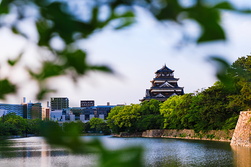 Hiroshima, Japan - May, 21, 2023: The Hiroshima Castle, also know as the Carp Castle, was built in the 1590s, destroyed in the atomic bombing attack in  1945, and rebuilt in 1948. It´s an original replica, and also serves as a museum telling the history of Hiroshima before the WWII.
