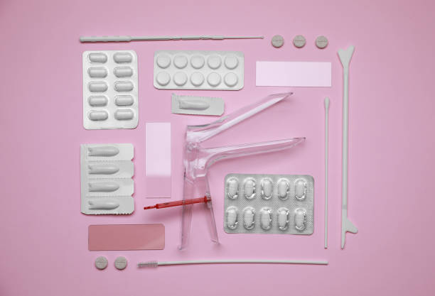 istock Sterile gynecological examination kit and medicaments on pink background, flat lay 1911067892