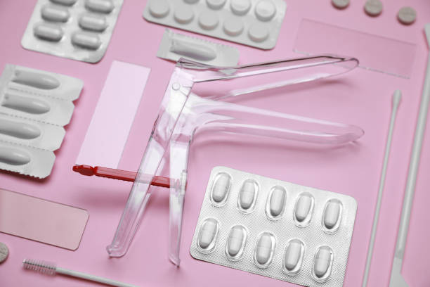 istock Sterile gynecological examination kit and medicaments on pink background 1911067893