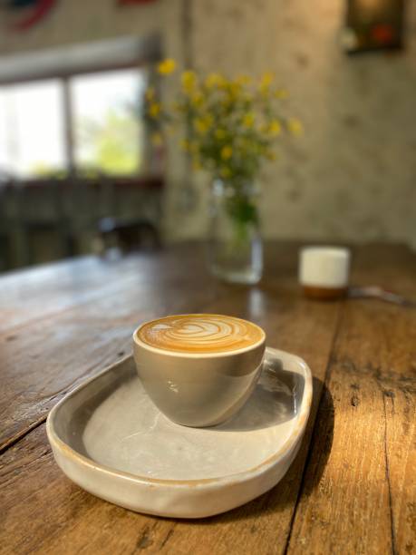 istock Hot Coffee in cup on wooden table in cafe 1911083990