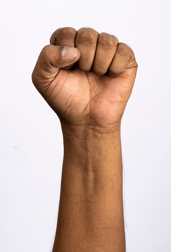 Holding fist up in the air isolated on white background