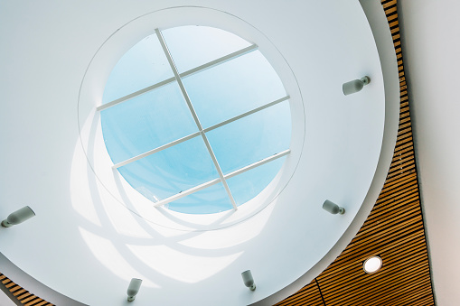 Little Rock, Arkansas, United States - June, 2015: Chandelier in the upper portion of the inside of the rotunda at the Arkansas State Capitol building. The photo was taken looking up from a lower level floor of the building.