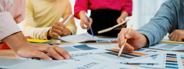 istock Interior designer discuss the color material with her colleagues. Variegated. 1911102316