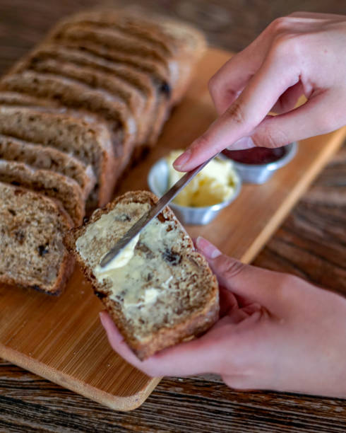 istock Spread Butter on a Slice of Bread 1911110639